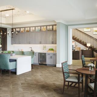 A modern, open-concept kitchen and dining area with contemporary furnishings.