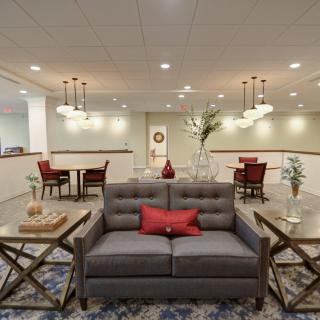 A modern living room with stylish decor and comfortable seating.