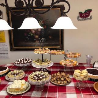 An inviting dessert buffet with a variety of sweets and pastries elegantly displayed on a table.