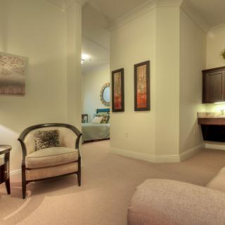 A cozy living room with elegant furniture and warm lighting.