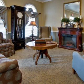 A cozy living room with elegant furniture and a fireplace.