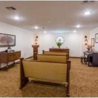 Spacious room with seating and elegant decor.