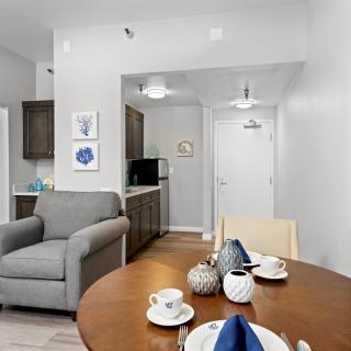 Modern open-plan living and dining area with a small kitchenette.