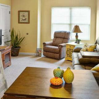 A cozy living room with comfortable seating and natural light.