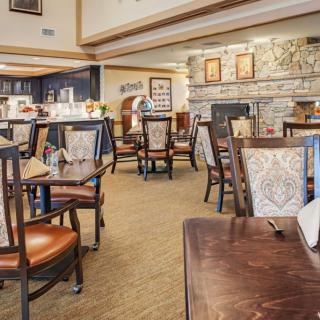 A cozy restaurant interior with neatly arranged tables and chairs.