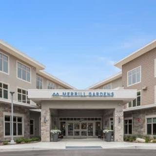 The front entrance of a Merrill Gardens retirement community building.