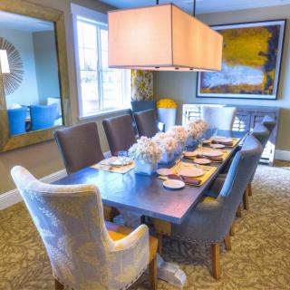 A stylish dining room with an elegant table setting and contemporary decor.