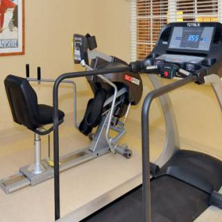A home gym setup featuring a treadmill and an exercise bike.