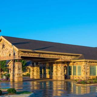 A stone building under a clear blue sky during the day.