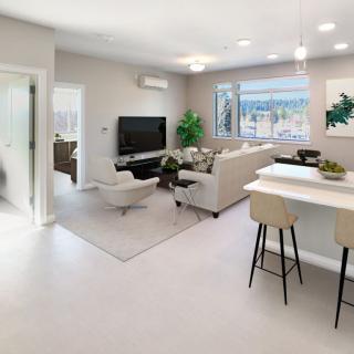 A modern living room with an open layout and a stylish kitchen island.