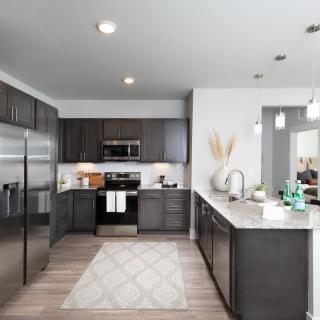 A modern kitchen with sleek cabinets and stainless steel appliances.