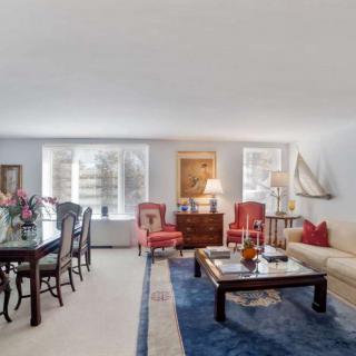 Spacious living and dining area with elegant furniture and decor.