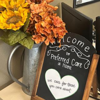 A welcoming decoration featuring flowers and a heartfelt message for those seeking care at home.