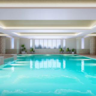 A serene indoor swimming pool, showcasing modern architecture and a tranquil atmosphere.