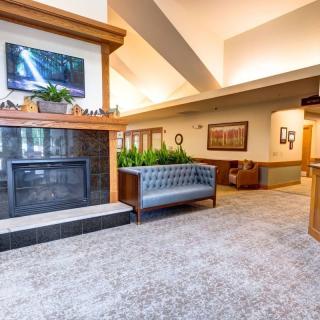 Stylish lobby with a fireplace and comfortable seating.