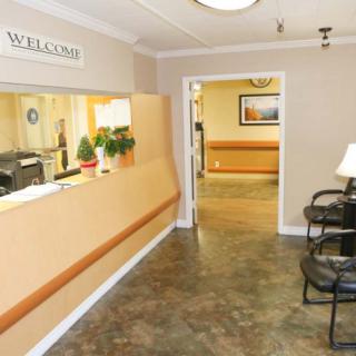 A welcoming office reception area with seating and a front desk.