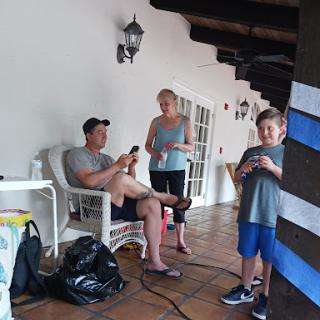 A family enjoying a relaxed moment together outdoors.