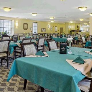A spacious dining room with tables set for service.
