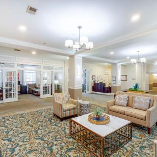 A modern lobby featuring comfortable seating, elegant lighting, and stylish decor.