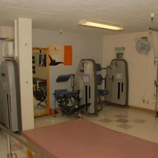 An indoor gym with various fitness equipment and exercise machines.