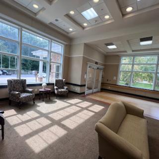 A bright and welcoming lobby featuring comfortable seating and ample natural light.