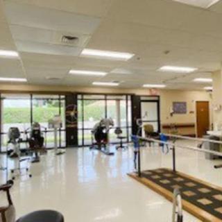 A rehabilitation clinic with exercise equipment and therapy areas.