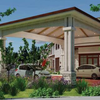 A modern house with a carport, featuring parked cars and well-maintained landscaping.