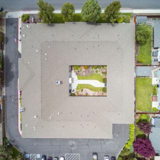 Aerial view of a building with a central courtyard.