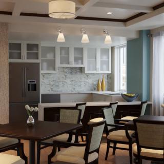 A modern kitchen and dining area with elegant furnishings and ambient lighting.
