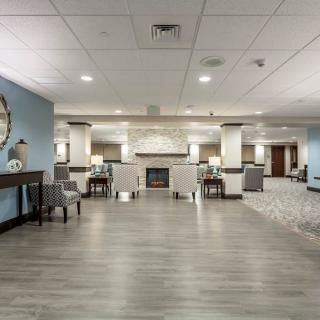 Modern hotel lobby with seating and stylish decor.
