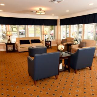 A modern lobby with comfortable seating and bright lighting.