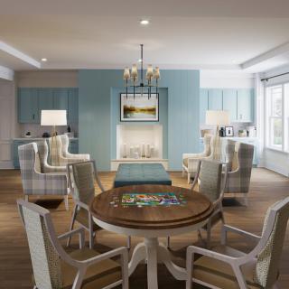A cozy living room with elegant furniture and a central round table.