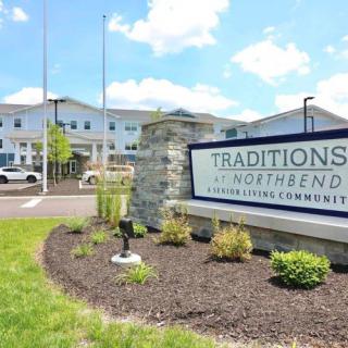 Entrance sign for Traditions at North Bend, a senior living community.