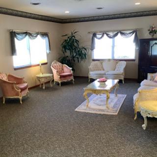 A cozy vintage living room setup with elegant furniture and natural light.