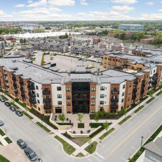 Aerial view of a modern apartment complex in an urban setting.