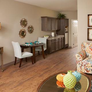 A cozy living space with a dining area and modern decor.