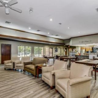 Spacious lounge area with comfortable seating and modern decor.