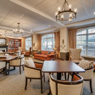 A cozy lounge area with elegant furniture and warm lighting.