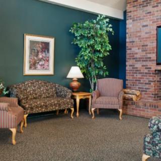 Cozy living room with patterned furniture and decorative elements.