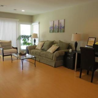 A cozy living room with comfortable seating and modern decor.