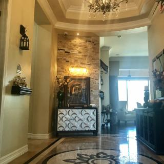 A luxurious foyer with elegant lighting and decor.
