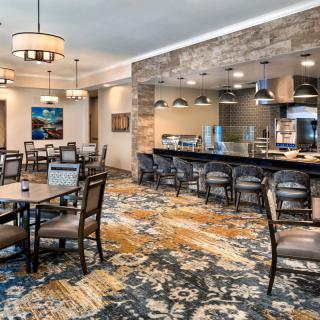 A modern restaurant dining area with stylish seating and lighting.