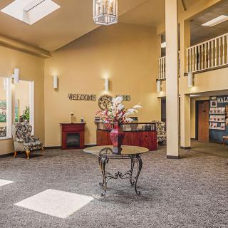 A spacious lobby with elegant decor and comfortable seating.