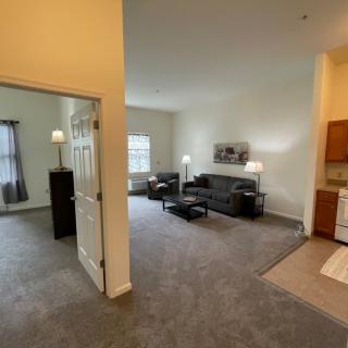 A modern apartment living room with a sofa and coffee table.