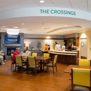 The inviting lobby area of The Crossings, featuring comfortable seating and a welcoming reception desk.