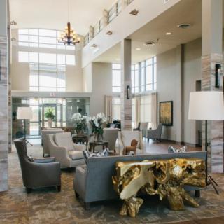 A spacious and luxurious lobby area featuring modern furniture and elegant decor.