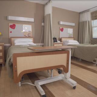 A hospital room with two beds and privacy curtains.