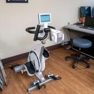 An exercise bike positioned in an office setting, ready for use.