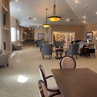 A spacious and well-lit dining area with comfortable seating arrangements.