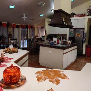 A cozy kitchen adorned with autumn decorations, perfect for holiday gatherings.